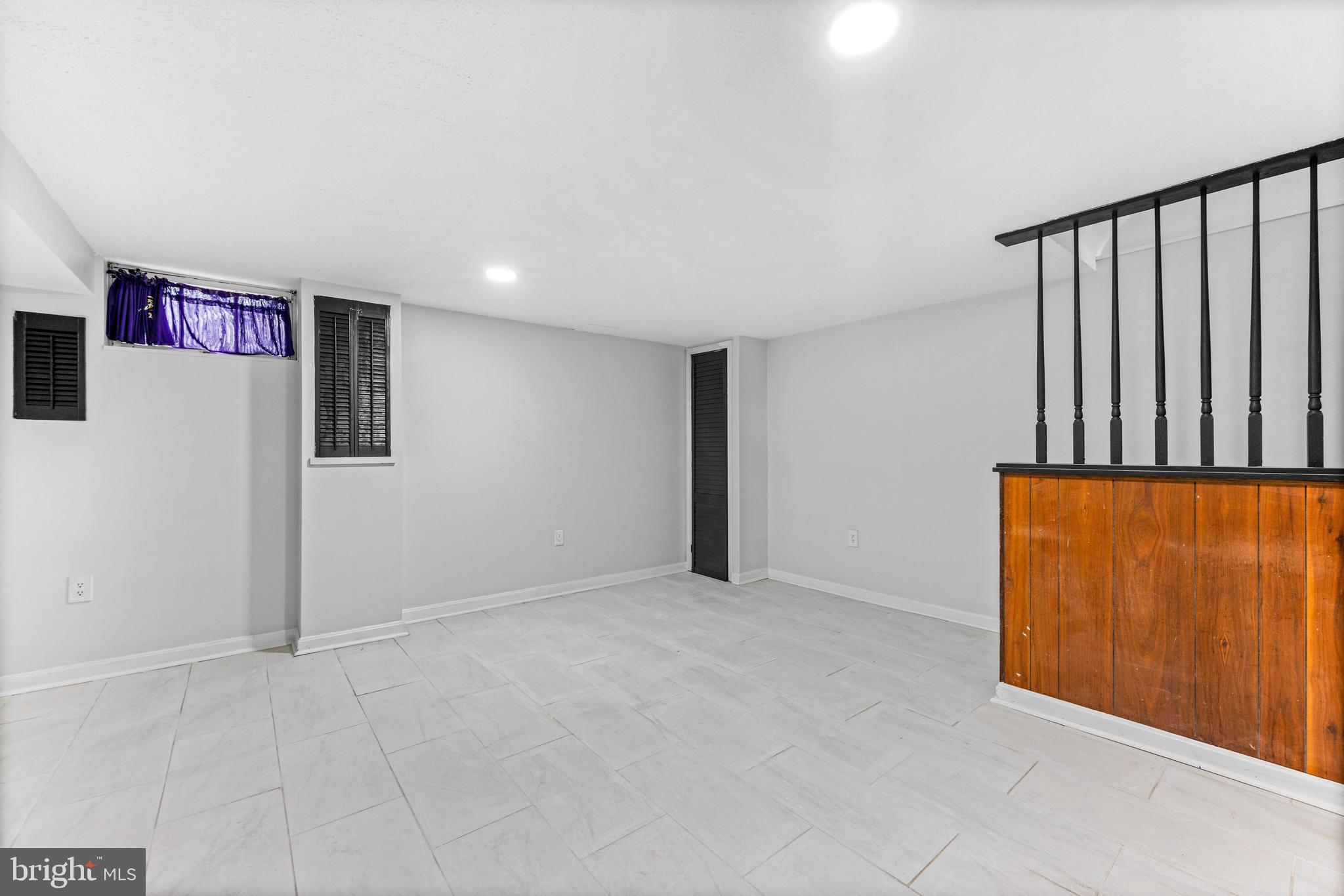 2134 Firethorn Road Middle River, MD 21220 - Photo 21 of 41 an empty room with wooden floor and windows