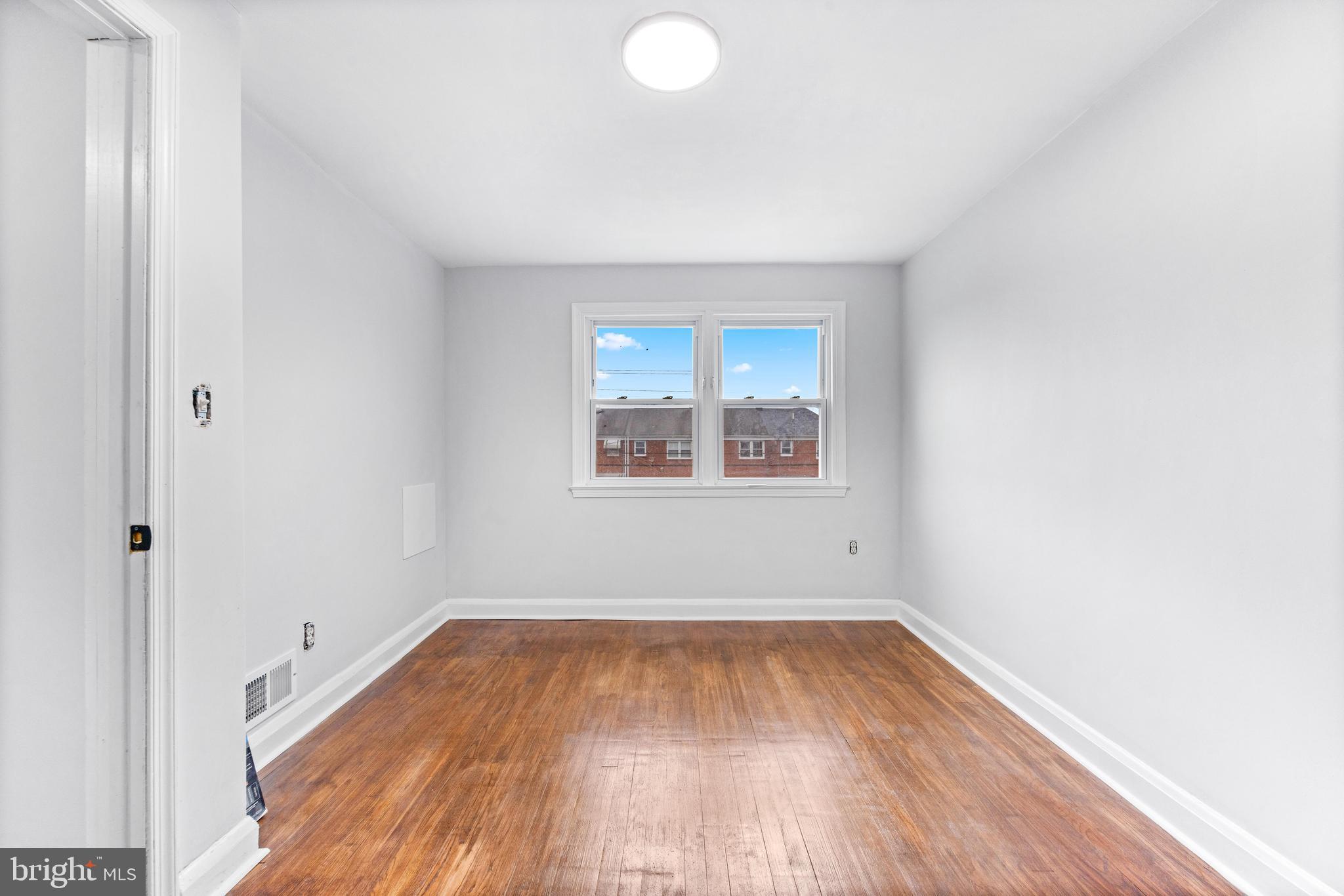 2134 Firethorn Road Middle River, MD 21220 - Photo 25 of 41 a view of empty room with wooden floor and fan