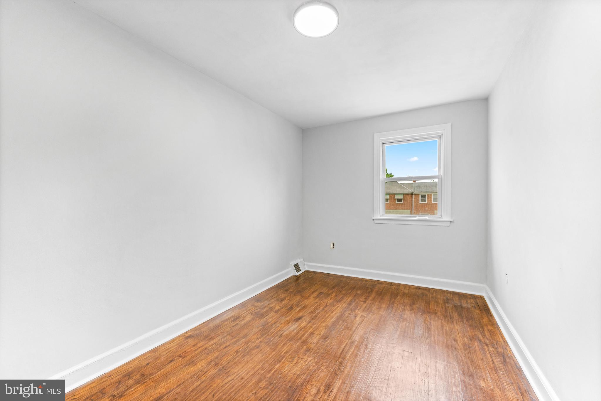 2134 Firethorn Road Middle River, MD 21220 - Photo 26 of 41 a view of empty room with wooden floor