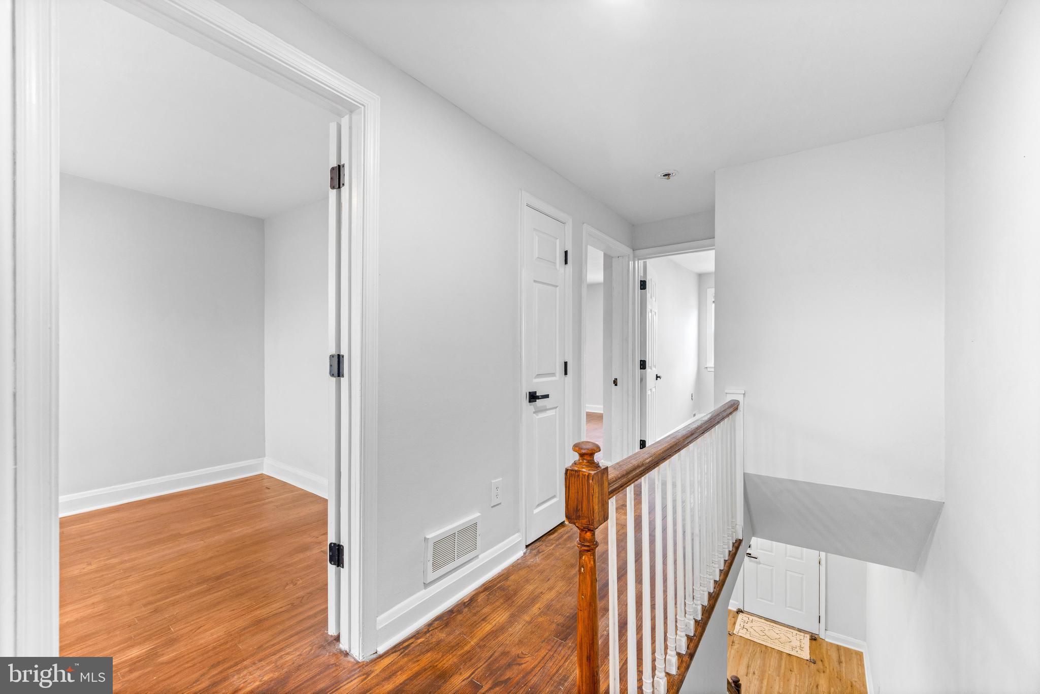 2134 Firethorn Road Middle River, MD 21220 - Photo 28 of 41 a view of a hallway with wooden floor and staircase