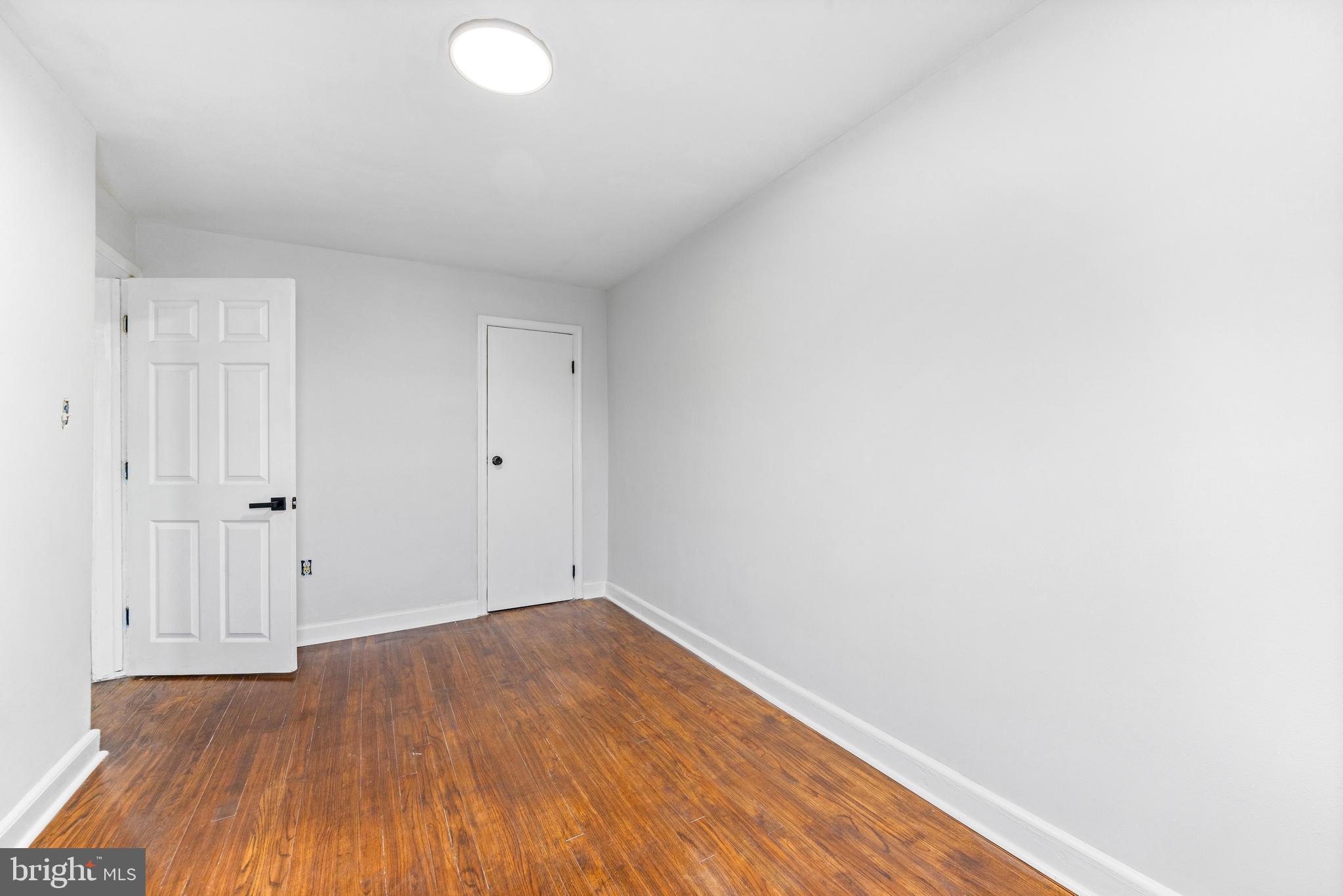 2134 Firethorn Road Middle River, MD 21220 - Photo 29 of 41 a view of an empty room with wooden floor