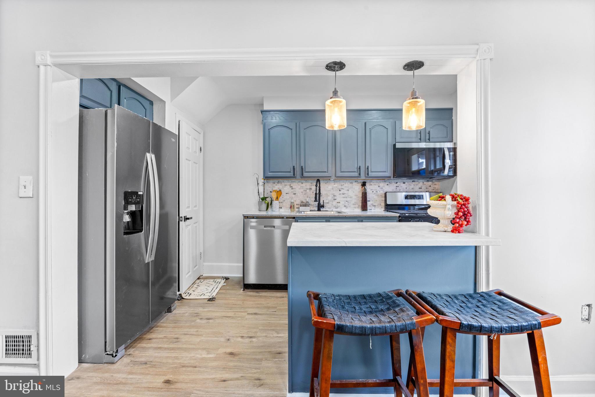 2134 Firethorn Road Middle River, MD 21220 - Photo 10 of 41 a kitchen with stainless steel appliances granite countertop a refrigerator and a stove top oven