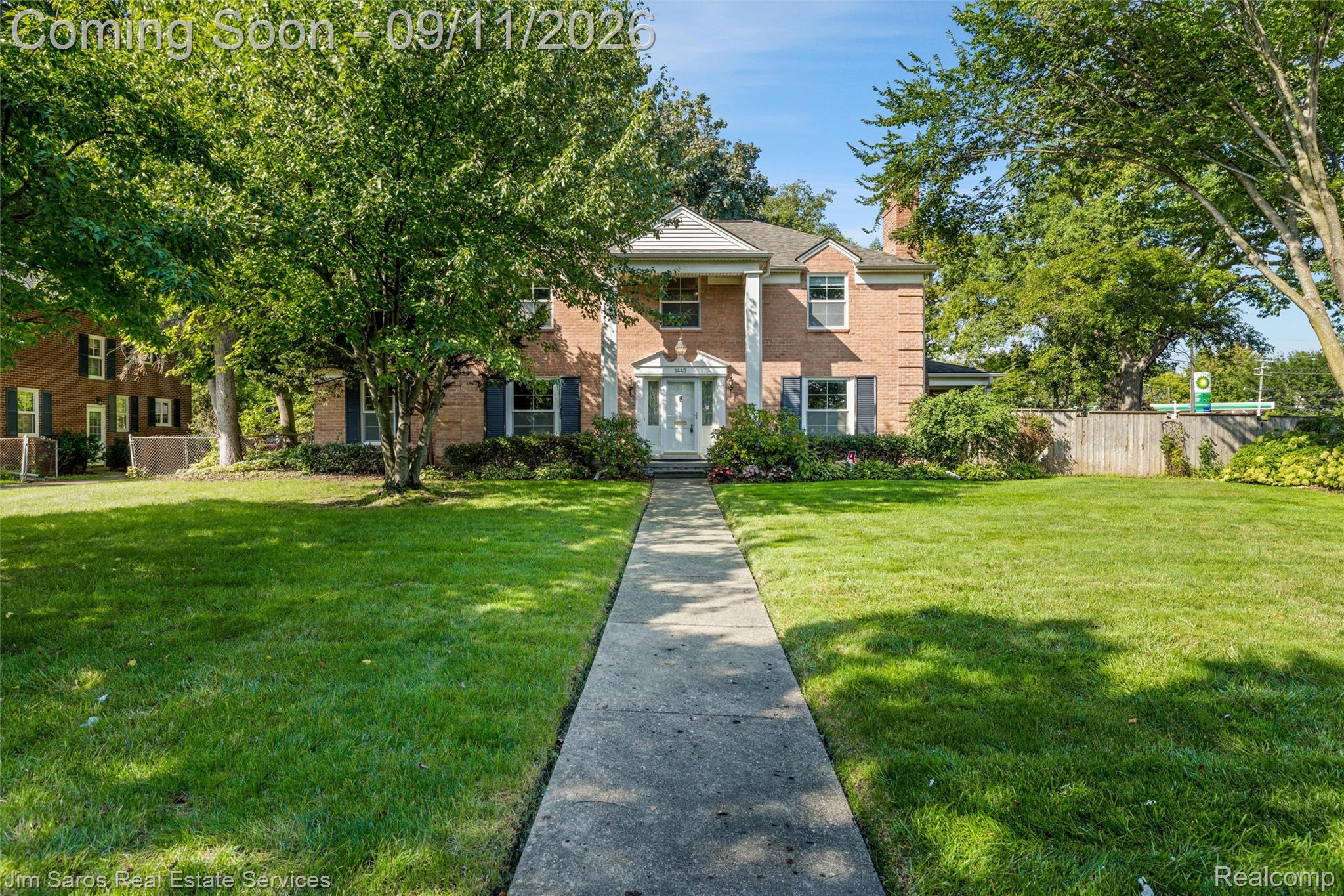 1445 Devonshire Road Grosse Pointe, MI 48230 - Photo 1 of 30 Brick exterior with white columns and shutters