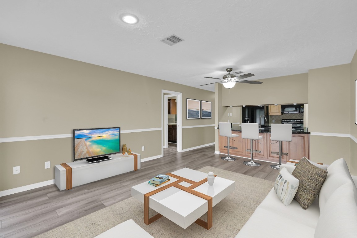 801 River Road, Unit 123F Montgomery, TX 77356 - Photo 16 of 32 a living room with furniture and view of kitchen