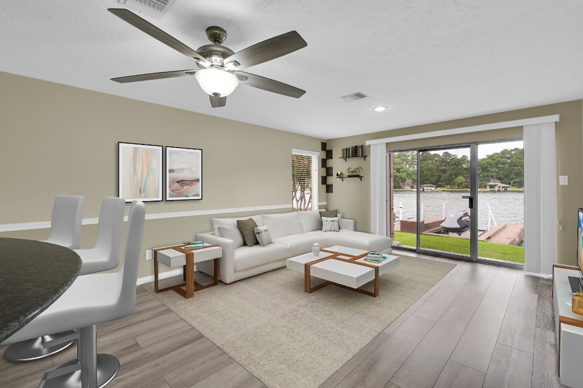 801 River Road, Unit 123F Montgomery, TX 77356 - Photo 17 of 32 a living room with furniture and a large window