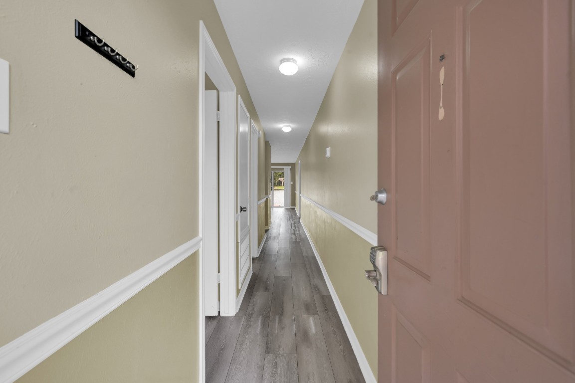 801 River Road, Unit 123F Montgomery, TX 77356 - Photo 8 of 32 a view of a hallway with wooden floor and staircase