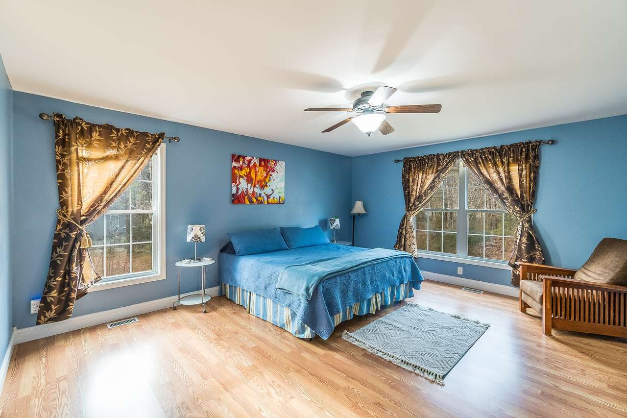 5712 Novaglen Road Durham, NC 27712 - Photo 12 of 27 Peaceful, spacious master retreat is away from the home office, so you can disconnect & relax after the workday! Master Bedroom