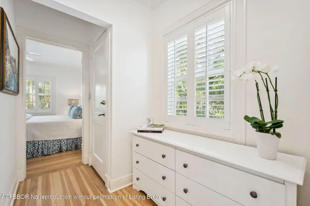 a bathroom with a sink a mirror and a window