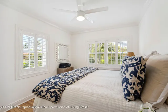 a bedroom with a bed and a chair