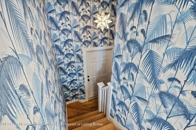 a view of a house with a door and furniture