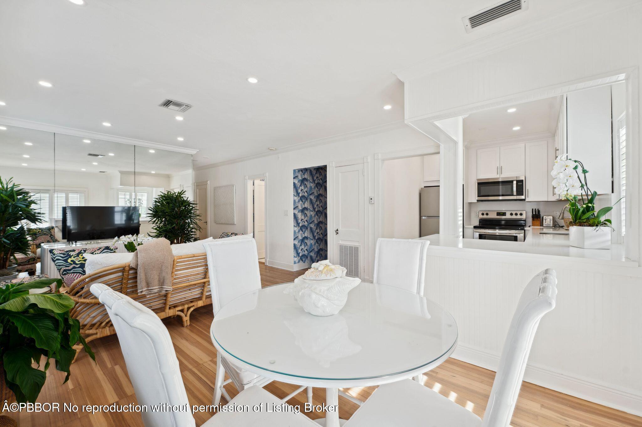 151 South County Road, Unit 2 Palm Beach, FL 33480 - Photo 6 of 22 a living room with furniture a flat screen tv and kitchen view