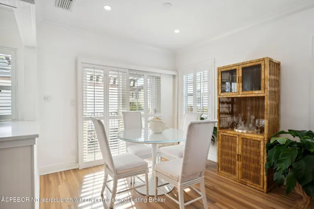 a dining room with furniture and windows