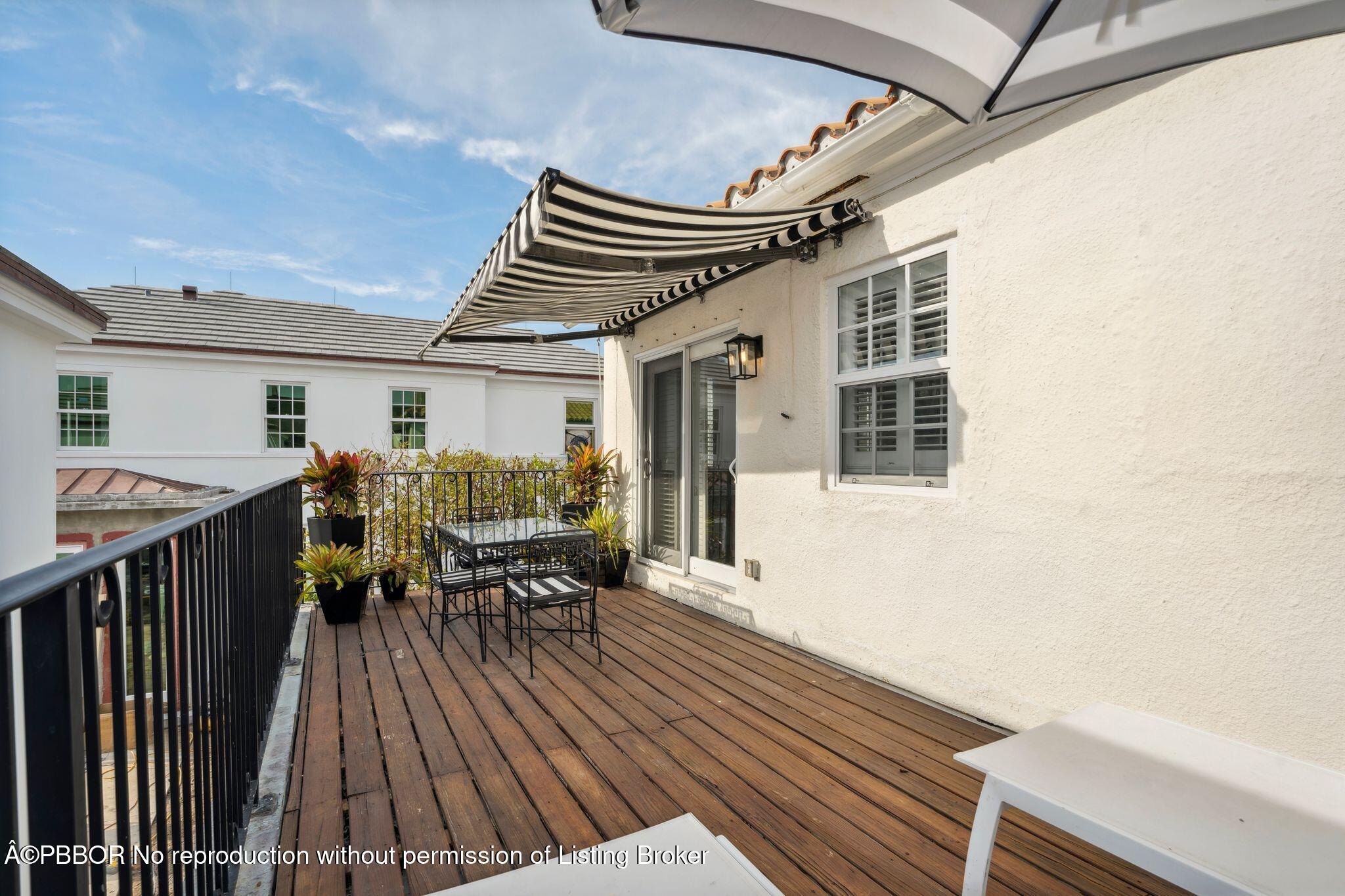 151 South County Road, Unit 2 Palm Beach, FL 33480 - Photo 10 of 22 a patio with wooden floor and outdoor seating