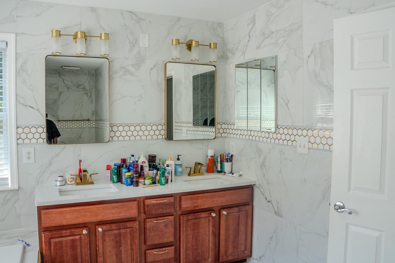 9737 Eustice Road Randallstown, MD 21133 - Photo 19 of 30 Primary bath with double sinks and modern mirrors.