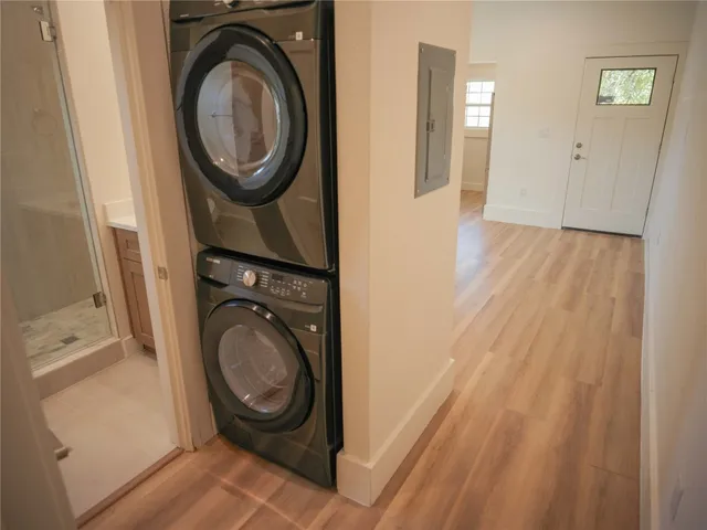 a view of a hallway with washer and dryer
