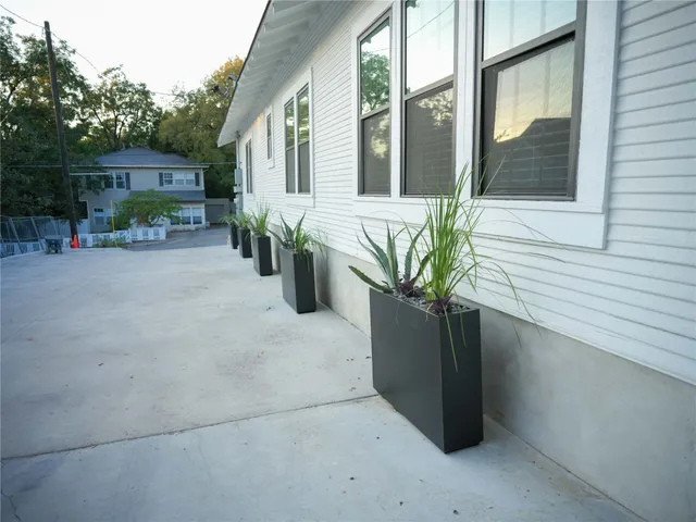 a view of potted plants on the balcony