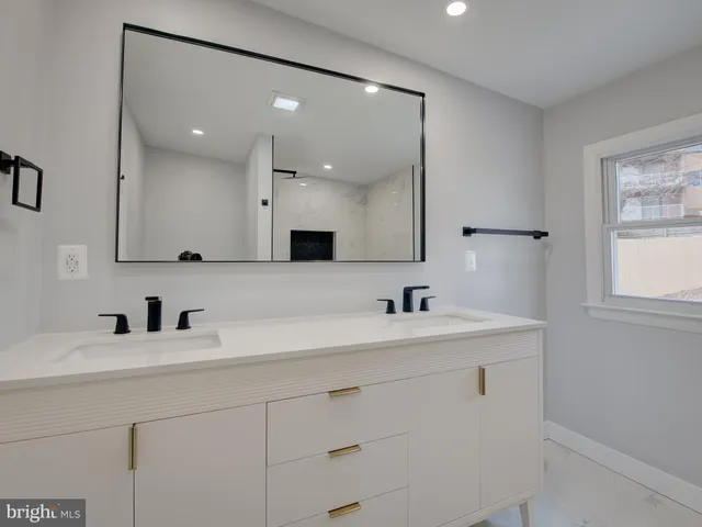 a kitchen with a sink cabinets and window
