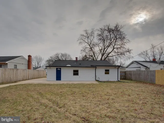 a front view of a house with large garden