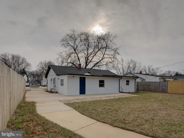 a front view of a house with trees