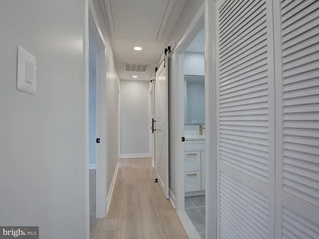 a view of a hallway with a closet