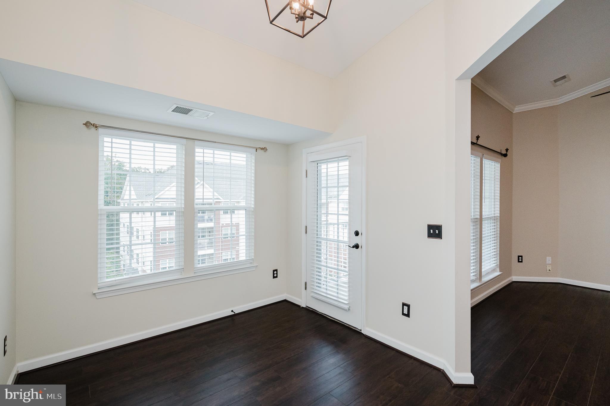 633 Wallingford Road, Unit 404 Bel Air, MD 21014 - Photo 16 of 52 a view of an empty room with wooden floor and a window