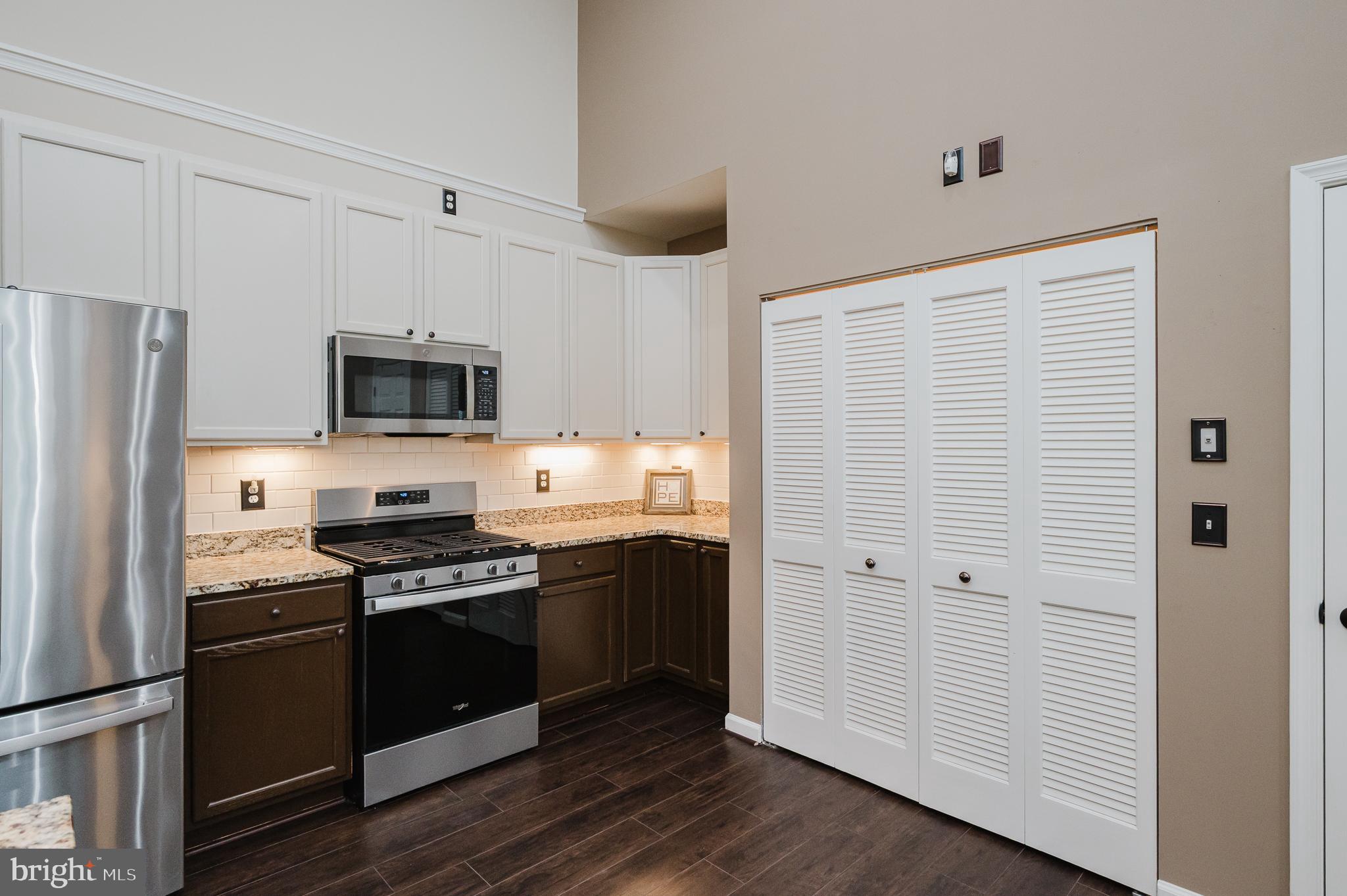 633 Wallingford Road, Unit 404 Bel Air, MD 21014 - Photo 20 of 52 a kitchen with stainless steel appliances a refrigerator stove and microwave