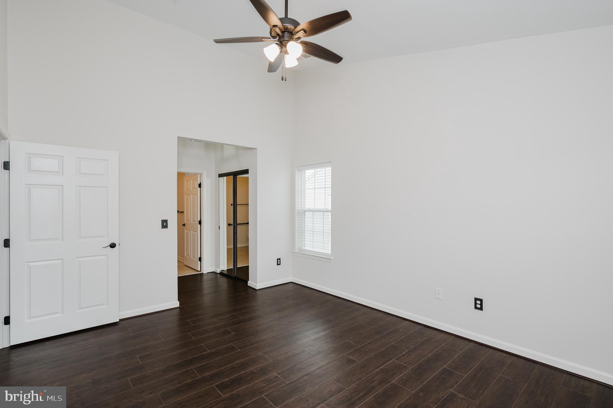633 Wallingford Road, Unit 404 Bel Air, MD 21014 - Photo 23 of 52 a view of an empty room with wooden floor