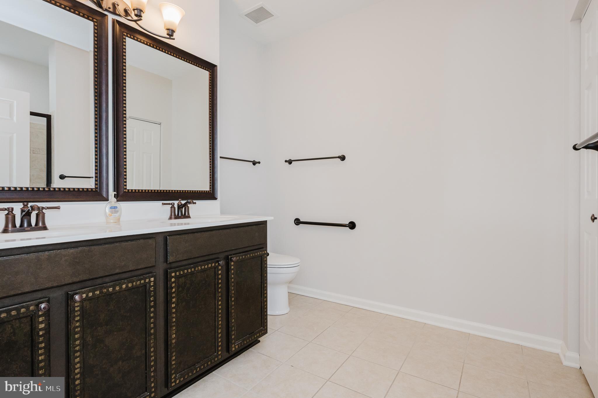 633 Wallingford Road, Unit 404 Bel Air, MD 21014 - Photo 26 of 52 a bathroom with a sink and a mirror