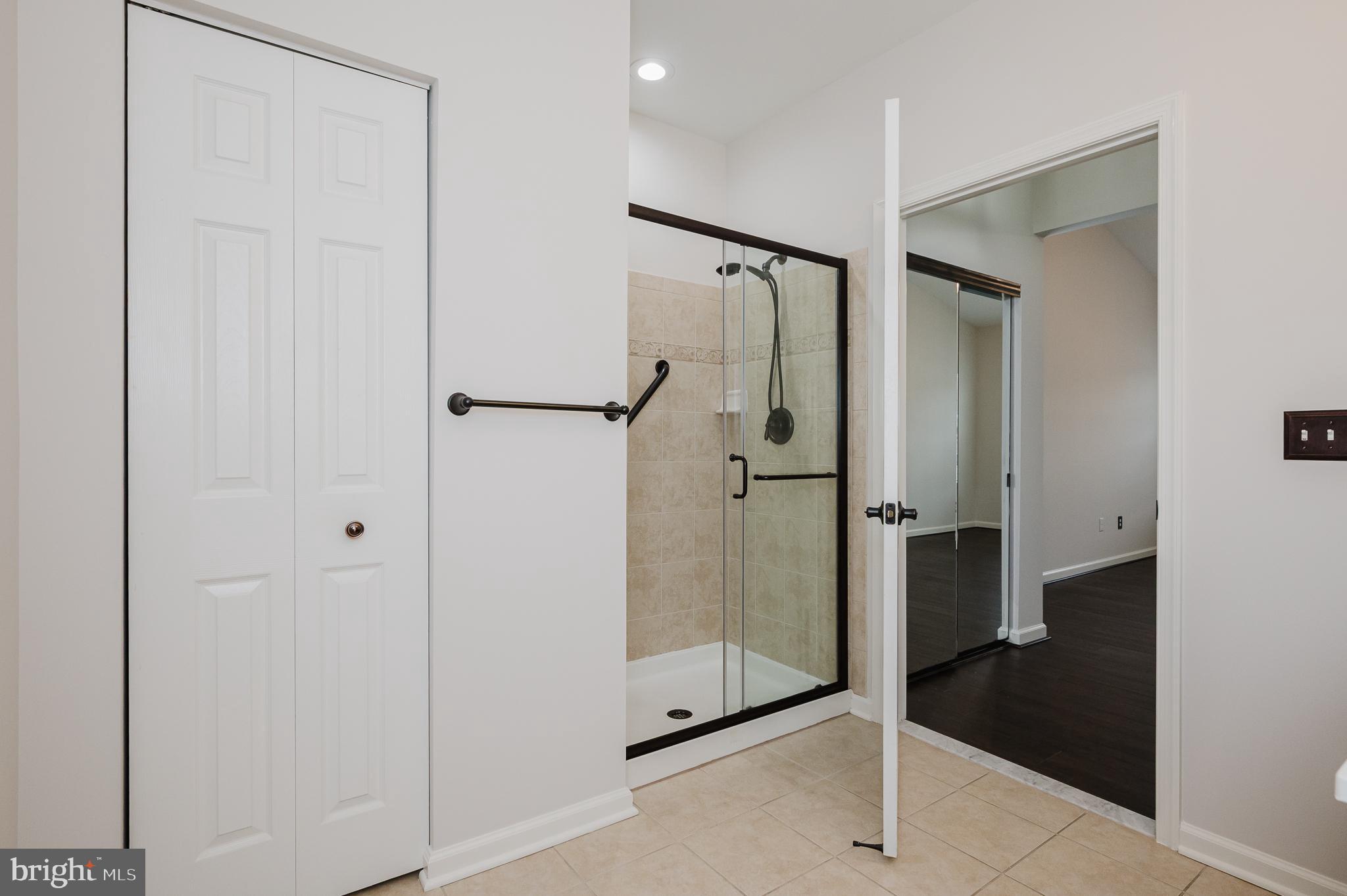 633 Wallingford Road, Unit 404 Bel Air, MD 21014 - Photo 28 of 52 a bathroom with a glass shower door