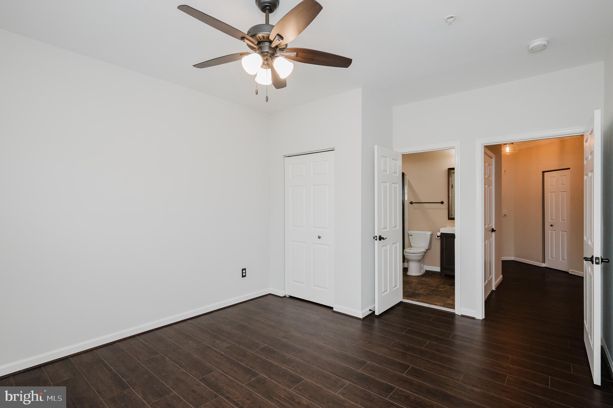 633 Wallingford Road, Unit 404 Bel Air, MD 21014 - Photo 31 of 52 an empty room with wooden floor and ceiling fan
