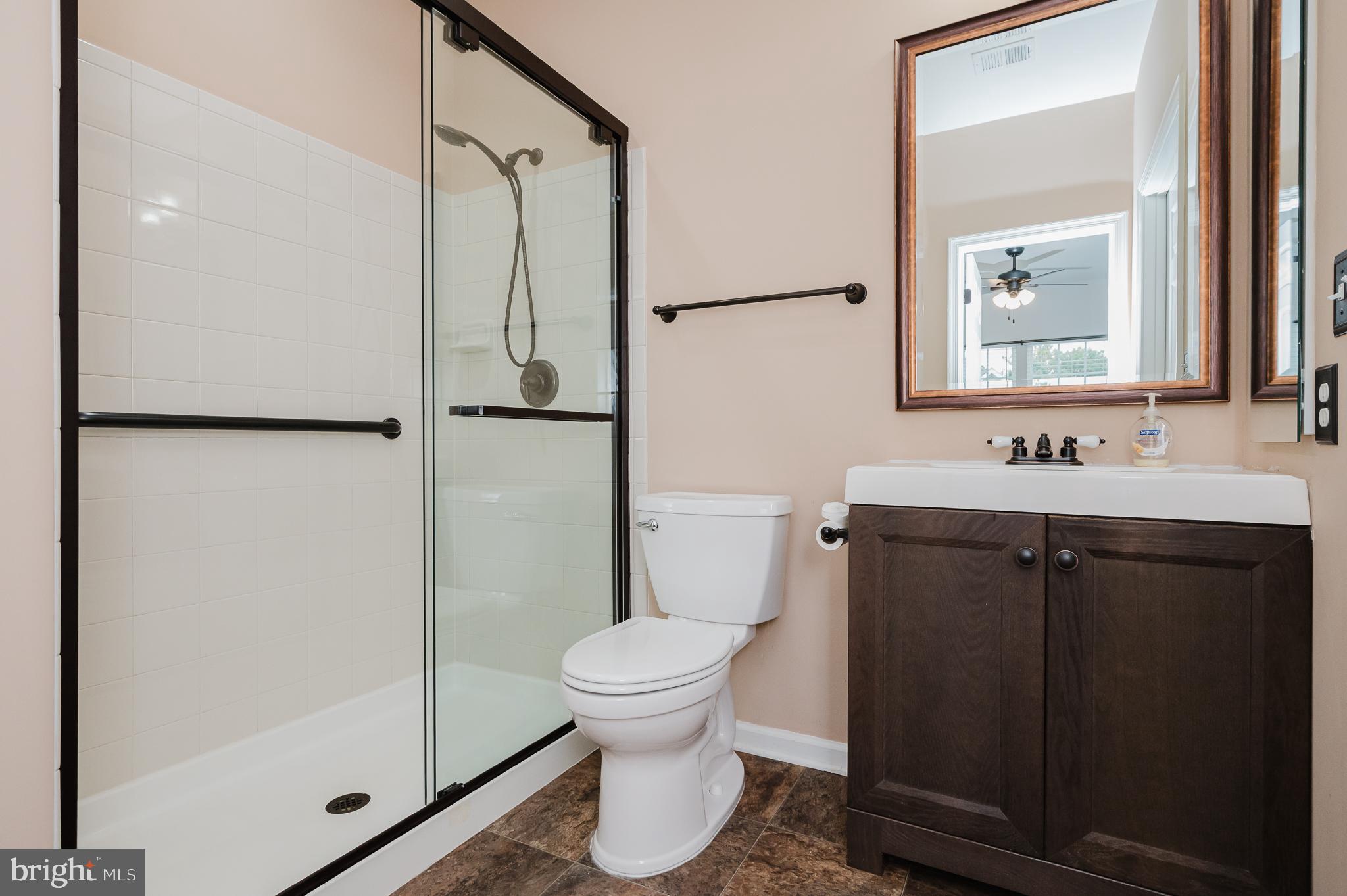 633 Wallingford Road, Unit 404 Bel Air, MD 21014 - Photo 32 of 52 a bathroom with a granite countertop sink toilet and shower