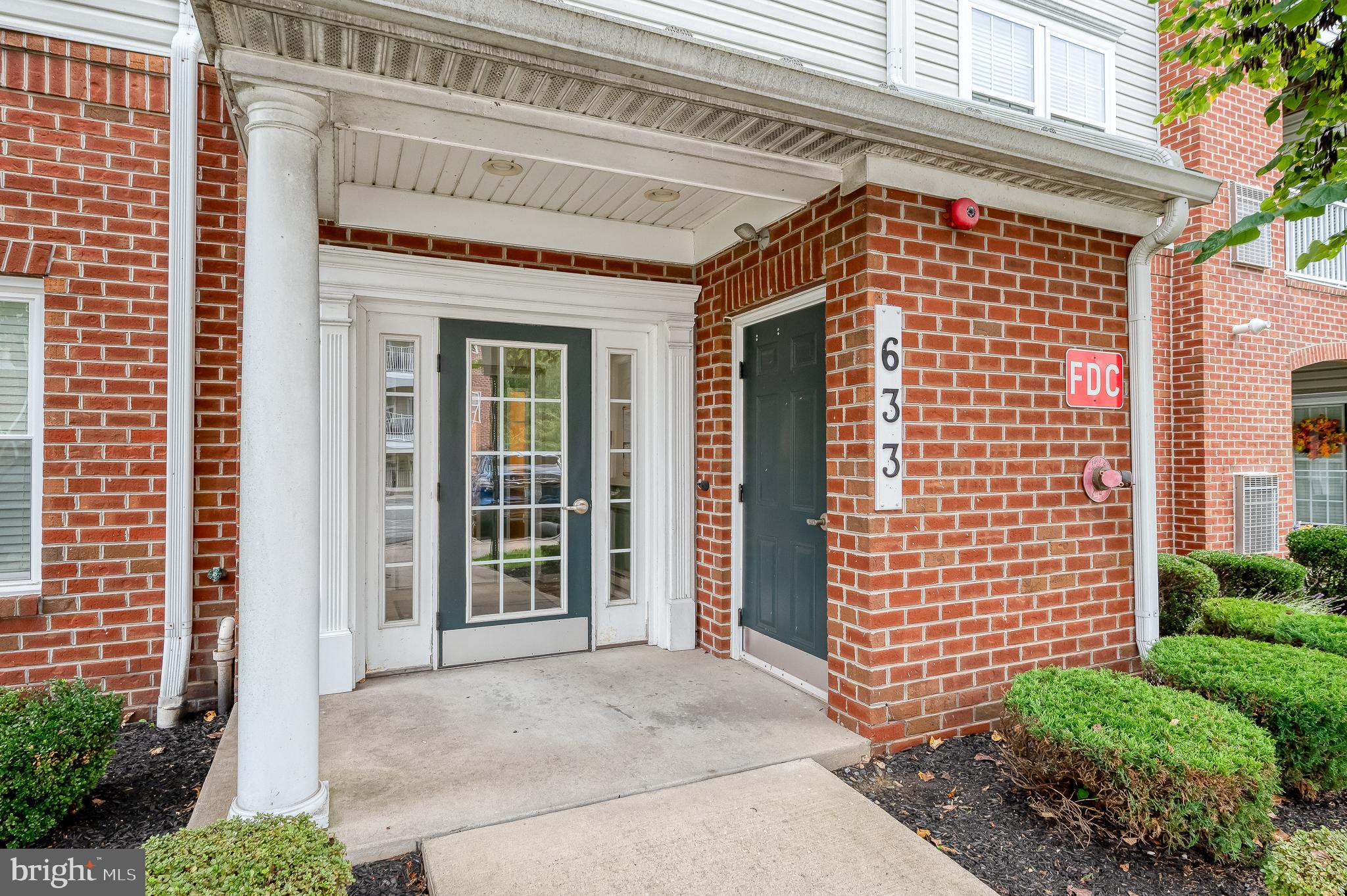 633 Wallingford Road, Unit 404 Bel Air, MD 21014 - Photo 4 of 52 a front view of a building with a garden