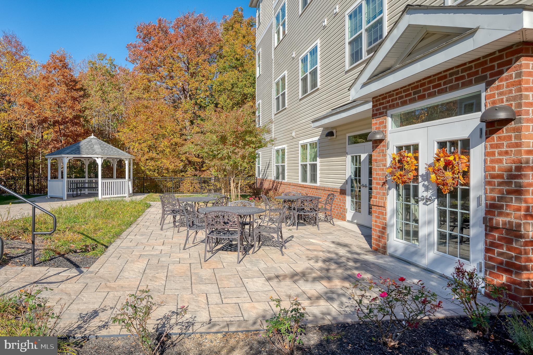 633 Wallingford Road, Unit 404 Bel Air, MD 21014 - Photo 40 of 52 a view of a patio with couches table and chairs and potted plants
