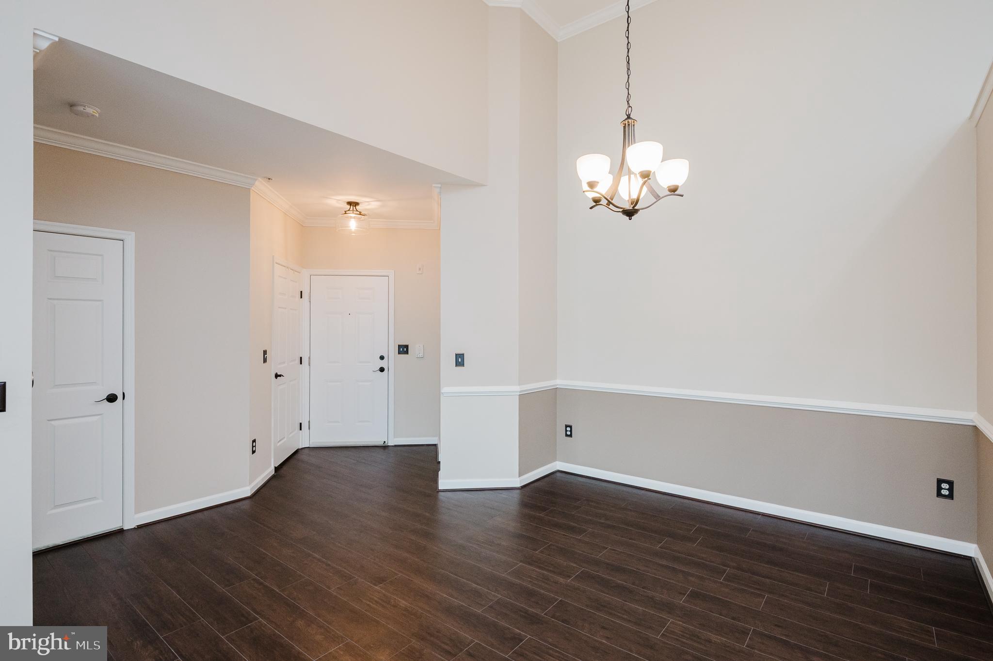 633 Wallingford Road, Unit 404 Bel Air, MD 21014 - Photo 10 of 52 a view of a room with wooden floor and ceiling fan