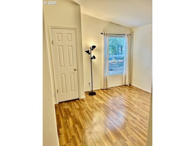 402 Sherwood Loop Florence, OR 97439 - Photo 14 of 33 a view of a bedroom with wooden floor and bathroom