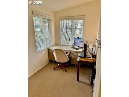 402 Sherwood Loop Florence, OR 97439 - Photo 19 of 33 a view of a workspace with furniture and a window