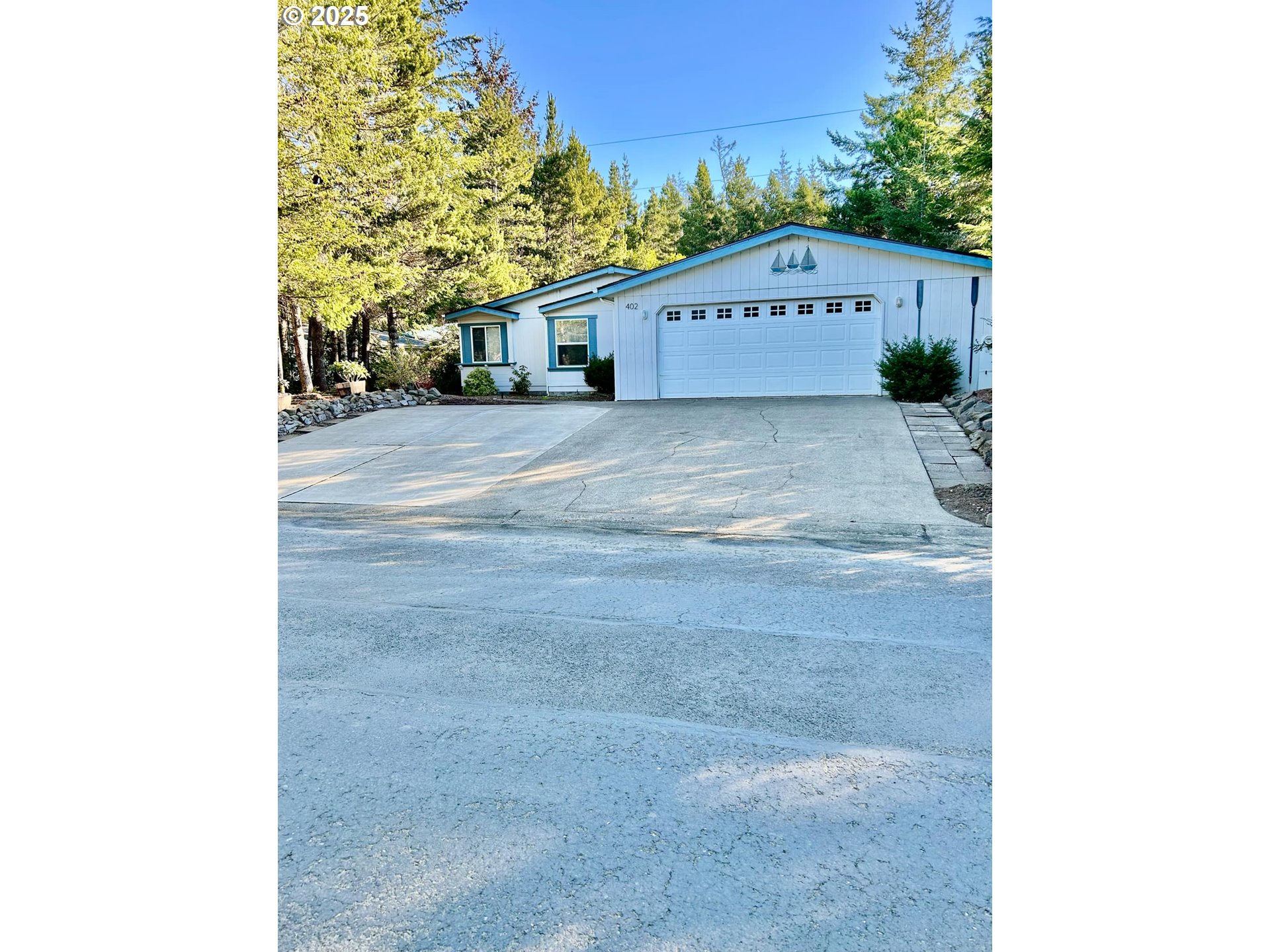 402 Sherwood Loop Florence, OR 97439 - Photo 2 of 33 a view of a big yard with house