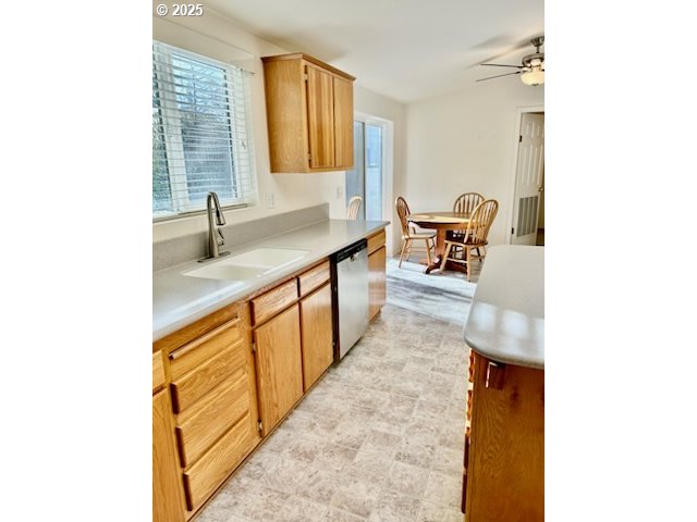402 Sherwood Loop Florence, OR 97439 - Photo 9 of 33 a hallway with a sink and a window with garden view