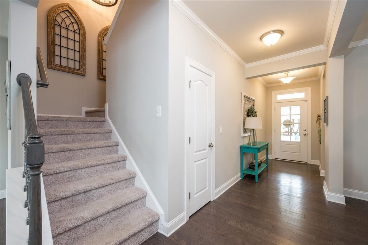 409 Morgan Ridge Road Holly Springs, NC 27540 - Photo 2 of 30 First floor features guest room/office and full bath, open concept living throughout dining, living room, breakfast and spacious kitchen Foyer