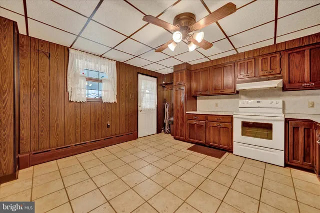 a kitchen with stainless steel appliances granite countertop a stove a sink and dishwasher cabinets