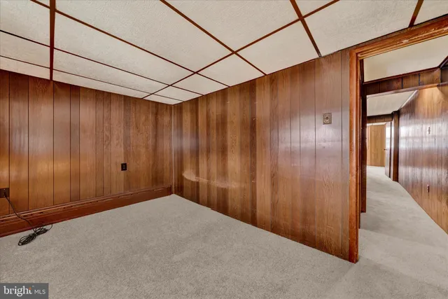 a view of a big room with wooden walls