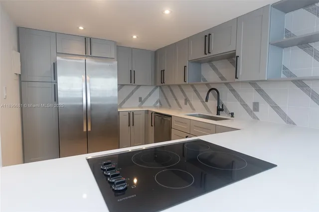 a kitchen with a stove and a refrigerator