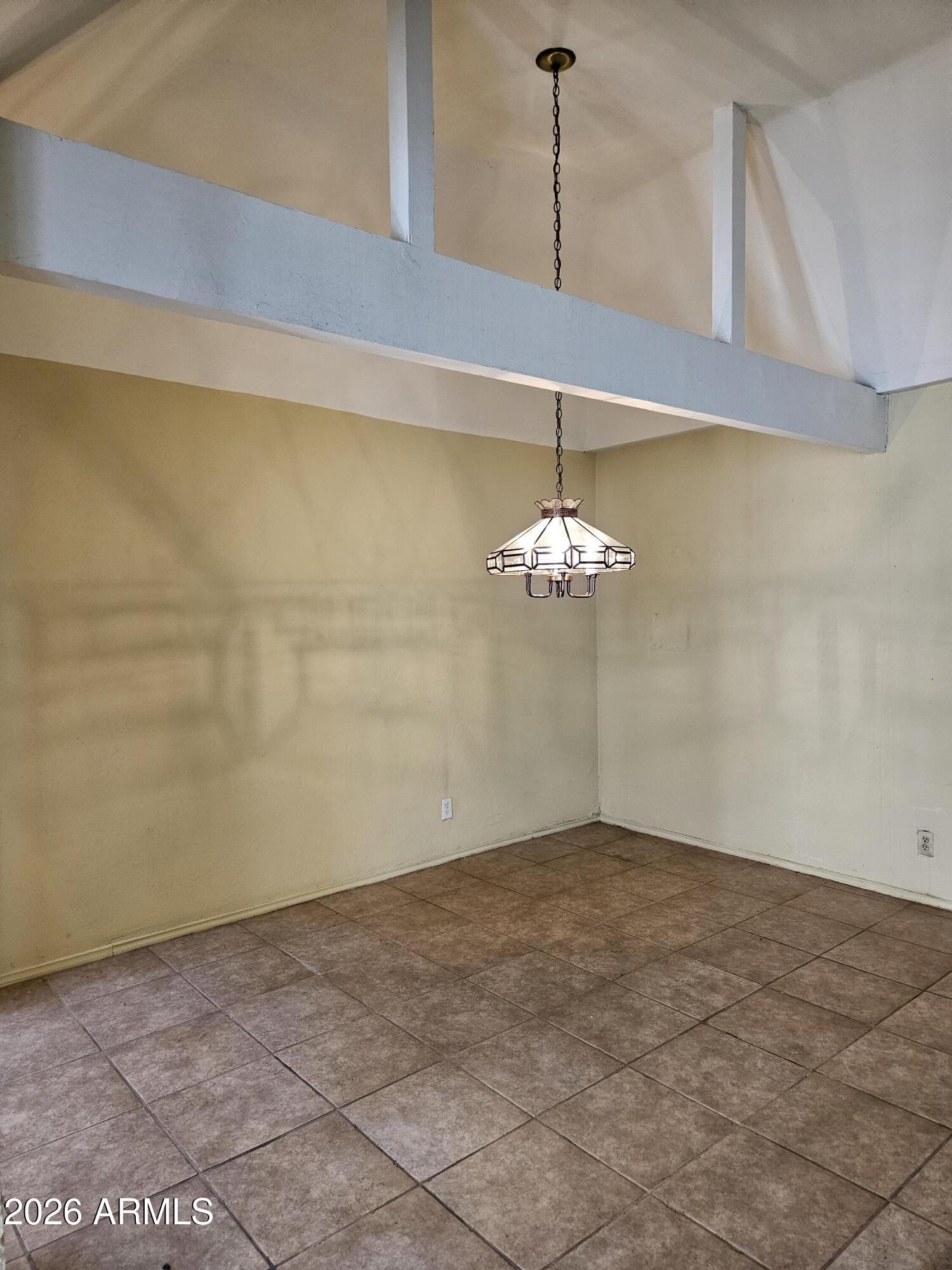 7003 North Barbados Place Phoenix, AZ 85021 - Photo 12 of 15 a view of a chandelier fan in an empty room