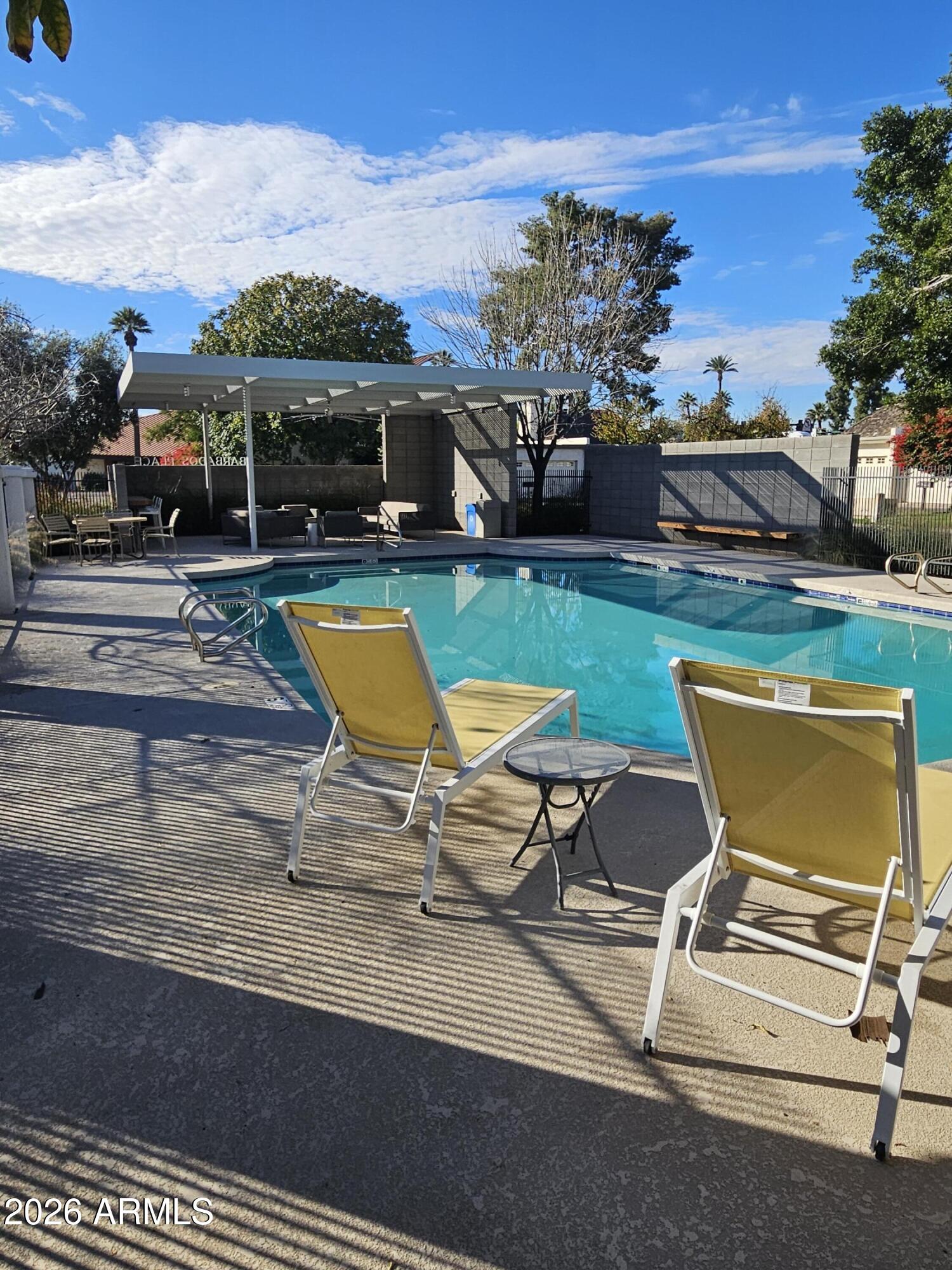7003 North Barbados Place Phoenix, AZ 85021 - Photo 3 of 15 a view of a swimming pool with lounge chairs