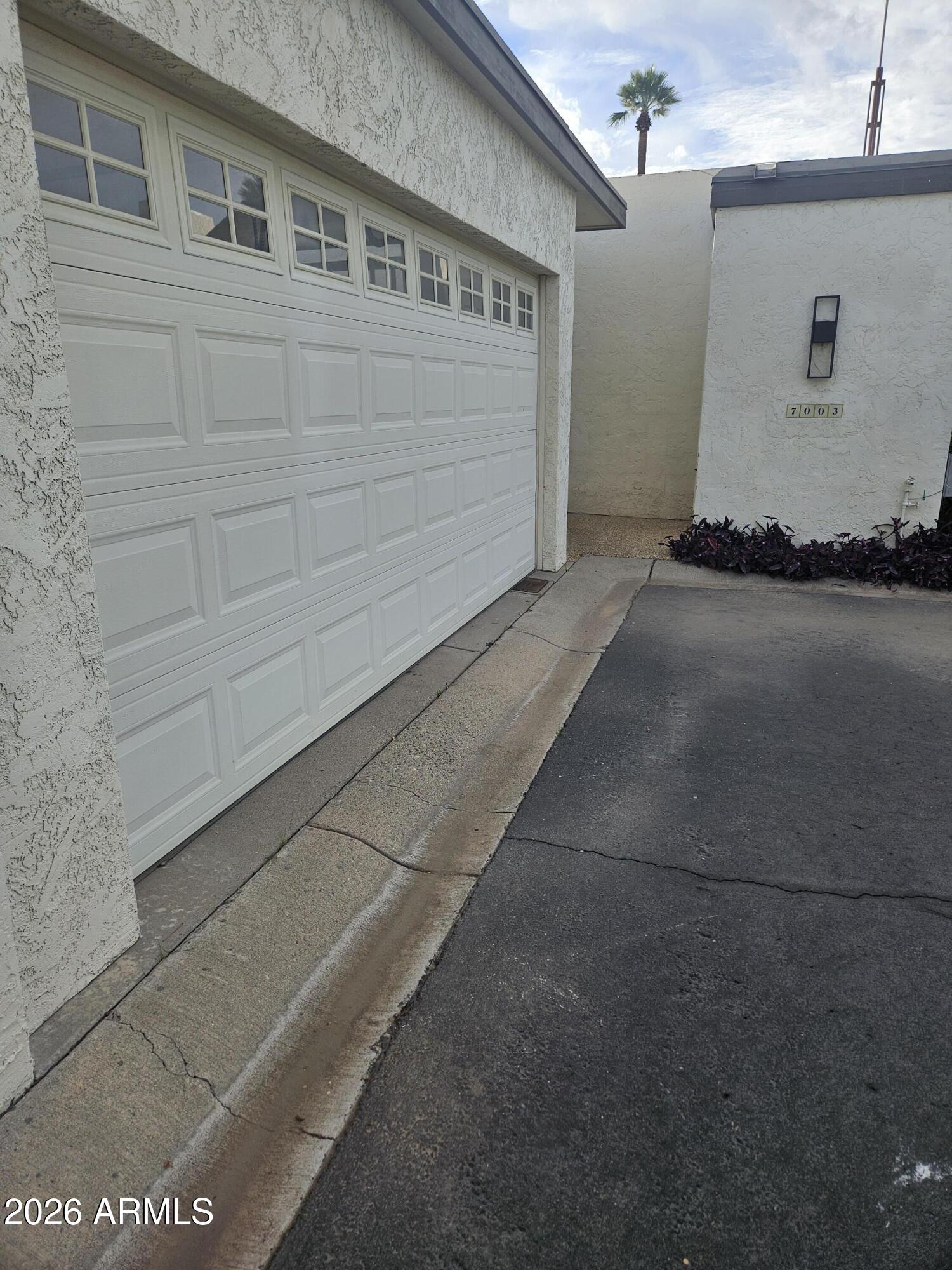 7003 North Barbados Place Phoenix, AZ 85021 - Photo 4 of 15 a view of a house with a garage