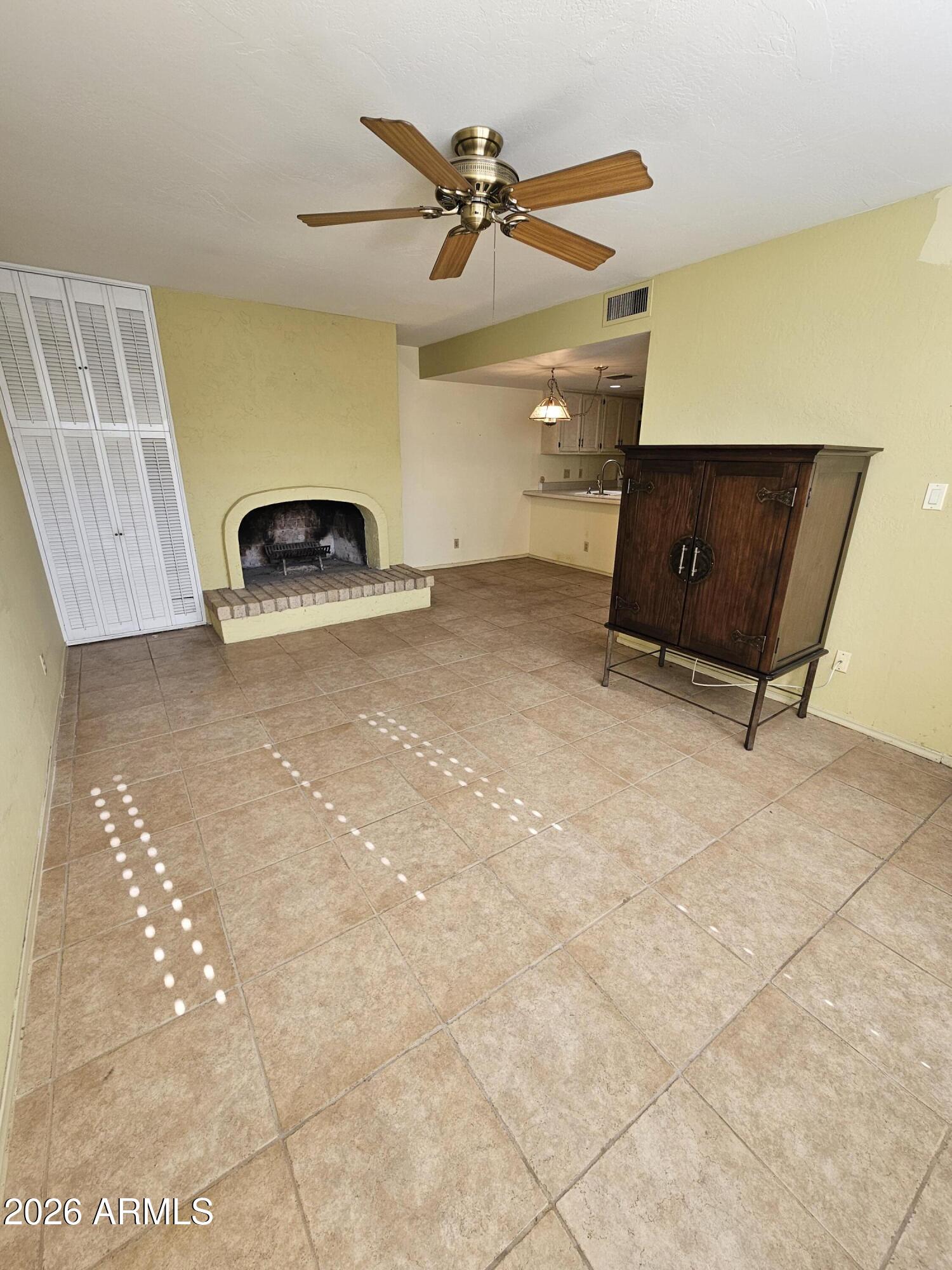 7003 North Barbados Place Phoenix, AZ 85021 - Photo 7 of 15 a view of room with a ceiling fan
