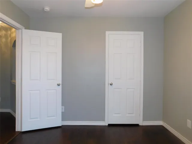 an empty room with wooden floor