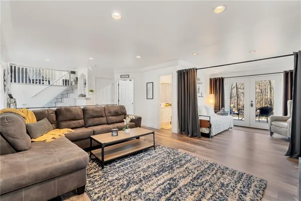 a living room with furniture and a rug