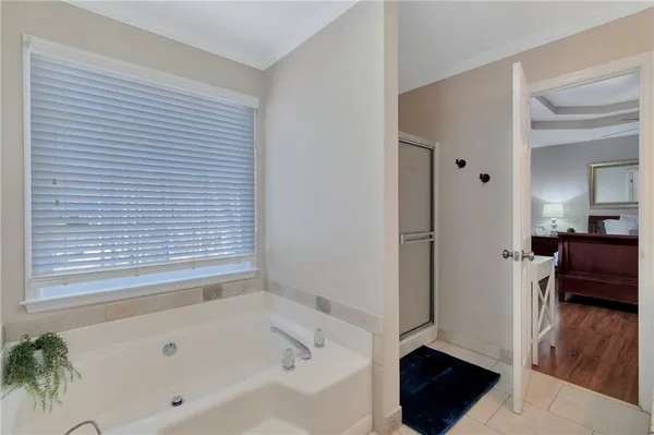 a bathroom with a bathtub and a shower