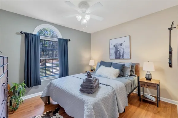 a bed room with a bed and a chandelier
